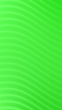 Abstract green motion background. Dynamic animated loopable vertical background video with wavy texture.