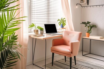 minimalist home office with peach armchair and laptop on desk