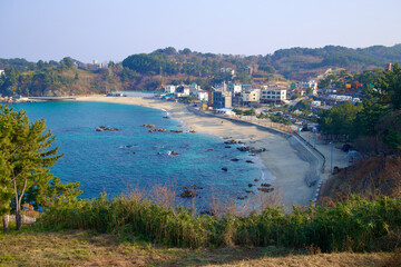 Obraz premium Hillside View of Jangho Beach and Surroundings