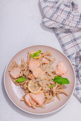 Plant based pasta with salmon, pesto and parmesan cheese. Ready to eat healthy food, served portion