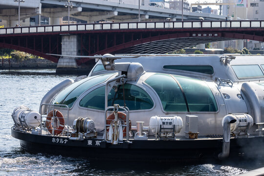Tokyo, Japan, 28 October 2023: Futuristic water bus 'Himiko' cruising on Sumida River.