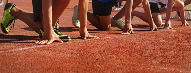 Cropped image of a sprinter getting ready to start at the stadium