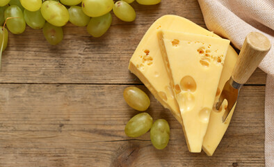 traditional maasdam cheese on a wooden board
