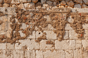 Ancient wall background with old concrete bricks