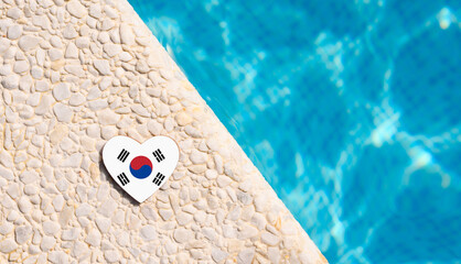 South Korea flag in the shape of a heart near the pool in the hotel. Holiday concept in hotels