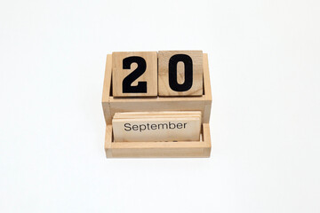 20th of September wooden perpetual calendar. Shot close up isolated on a white background