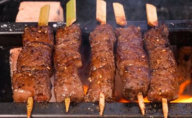Beef Ribs Meat stripes sliced cooking with flame. Homemade cooking shish kebab beef ribs for restaurant, menu, advert or package, close up, selective focus - 726541340