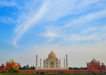 The Taj Mahal with a blue sky background and whispy clouds