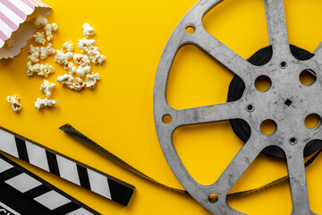 Vintage film reels and popcorn - cinema concept, top view