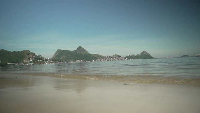 View of Charitas beach, on the Niter&oacute;i waterfront, bathed by the waters of Guanabara Bay and, in the background, the Tijuca mountain range, Rio de Janeiro, Brazil