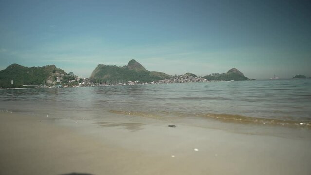 View of Charitas beach, on the Niter&oacute;i waterfront, bathed by the waters of Guanabara Bay and, in the background, the Tijuca mountain range, Rio de Janeiro, Brazil