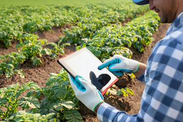 Farmers collecting data in their fields via technology for maximum results in the ever-changing environmental landscape