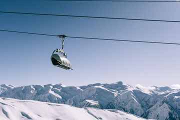 Ski lift at ski resort in  high mountains