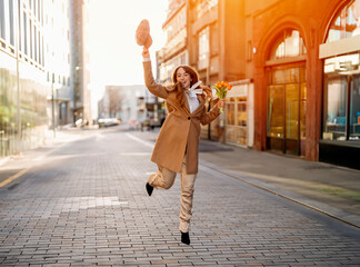 young happy woman with a heart-shaped balloon falling a love, having a fun day, walking around  an English city Lifestyle, tourism, valentines day, world woman's day concept