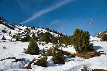 Landscape of the Catalan Pyrenees with mountain snow in spring, Val de Aran Lleida Spain. 