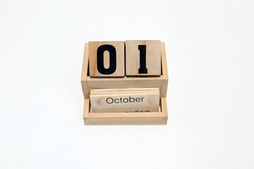 1st of October wooden perpetual calendar. Shot close up isolated on a white background