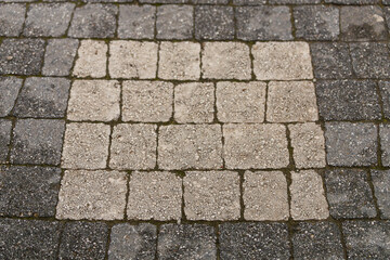 The wall is paved with gray stones, top view. stone texture, outdoor stone tiles