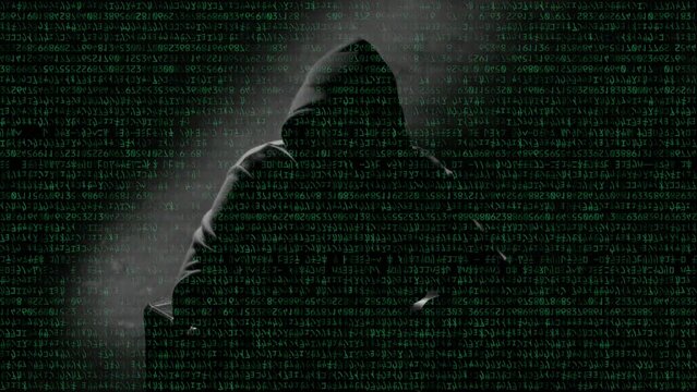 Anonymous man in a hood interview video footage, mysterious man sitting on a chair and talking. Anonymous hacker interview with no visible face footage, computer hacker conceptual background