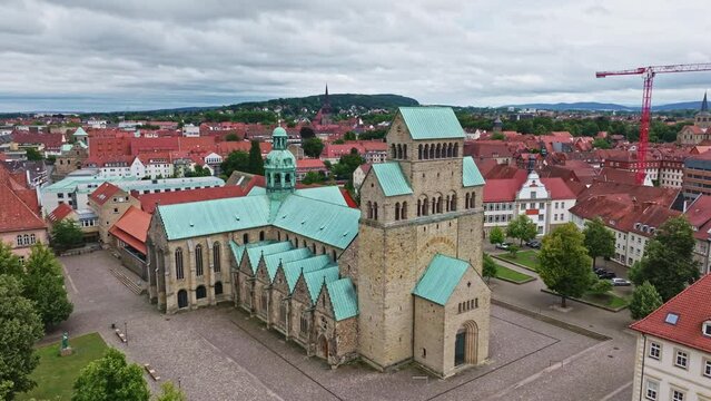 Aerial drone view of Hildesheim Cathedral, officially the Cathedral of the Assumption of Mary or simply St. Mary's Cathedral, is a medieval Roman Catholic cathedral in the city centre of Hildesheim