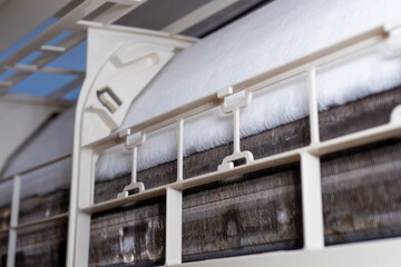 close-up of Frozen or Ice in the air conditioning. Problems with home cooling systems are caused by...