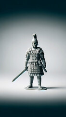 Fototapeta premium Toy medieval warrior. Plastic Roman soldier with a sword.