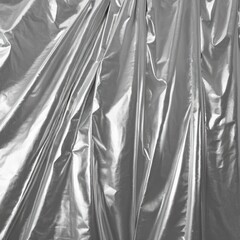 a black and white image of a shiny piece of foil