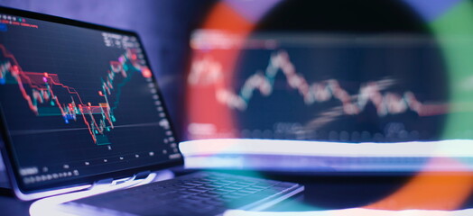 Business trend, market analysis on a tablet against the background of charts