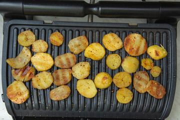 potato rolls with spices fried on the grill