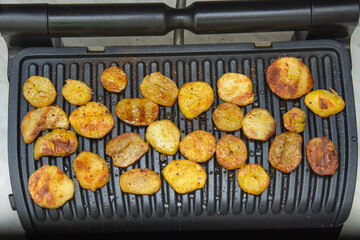 potato rolls with spices fried on the grill