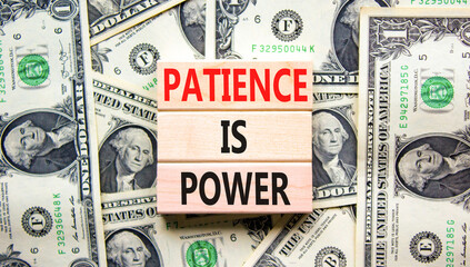 Patience is power symbol. Concept words Patience is power on beautiful wooden blocks. Dollar bills....