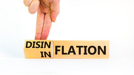 Inflation or disinflation symbol. Concept word Inflation Disinflation on beautiful wooden cubes. Beautiful white background. Businessman hand. Business inflation disinflation concept. Copy space.
