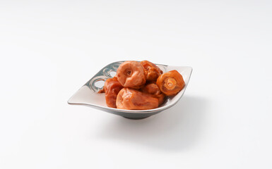 Dried dates fruits isolated on white background.