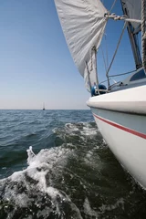 Foto op Plexiglas Zeiljacht op de zee met in de verte een andere zeilboot © ArieStormFotografie