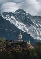 A mountaineer with a backpack observes the great mountain of Pumori while making the ascent to Everest Base Camp in the Himalayas Nepal