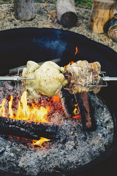 Meats roasting over campfire