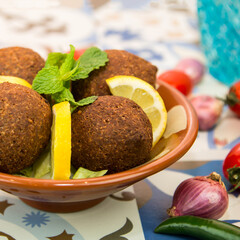 Kibbeh, Kebah, kebbah or kubbah with lime slice served in dish isolated on table top view of arabic food