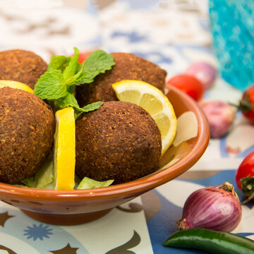 Kibbeh, Kebah, kebbah or kubbah with lime slice served in dish isolated on table top view of arabic food