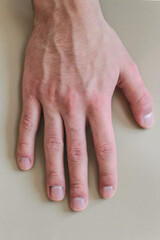 a young man shows gestures of the deaf and dumb. the language of people with disabilities. sign language