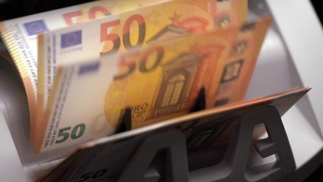 Money counter machine is counting EURO european banknotes.