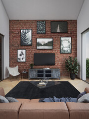 Industrial loft with a brick wall covered with paintings, parquet, modern furniture including a leather sofa and plants