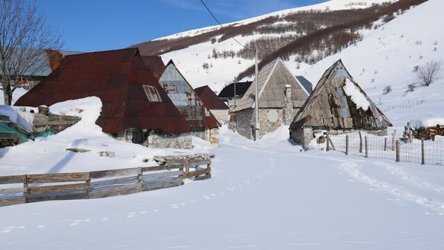 View of a mountain village Lukomir during winter. Snow white landscape and mountaineer lifestyle.