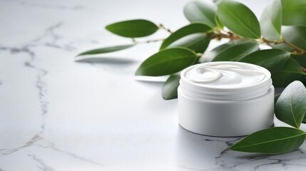 Facial cream and other men's cosmetic with green leaves on grey stone table. Mockup for design