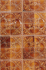 Decorative square of classical tiles in brown with complex pattern