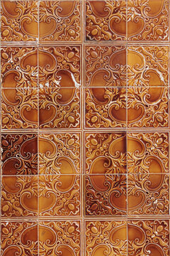 Decorative square of classical tiles in brown with complex pattern