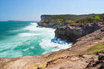Australian coast, high cliffs on the seashore, seaside landscape with blue water, view from the...