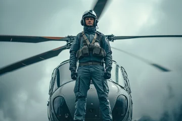 Crédence de cuisine en verre imprimé hélicoptère A male pilot stands near a helicopter