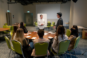 business meeting the audience asks a question or offers an idea to the speaker during a brainstorming session