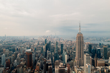 film vintage style view of New York City skyline looking down past the Empire State Building towards downtown skyscrapers with vintage colors giving off a 90's feel