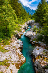 Rapids and narrows of Soca or Isonzo river (Emerald River) in Slovenia, a wild alpine river with...