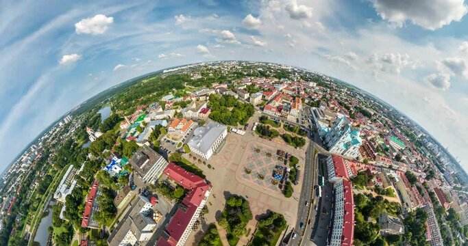 tiny planet in sky with clouds overlooking old town, urban development. Transformation of spherical 360 panorama in abstract aerial view.